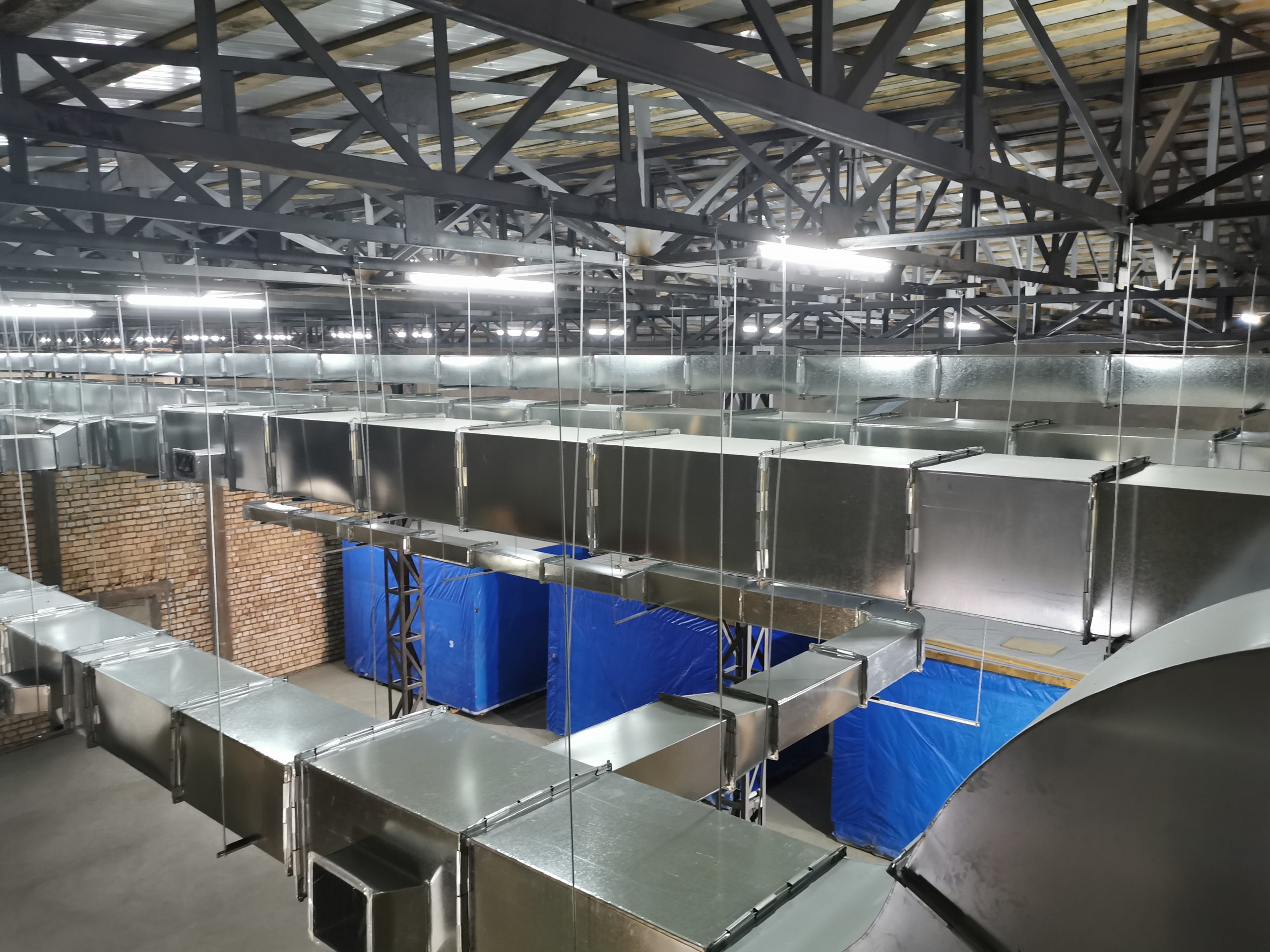 Overhead ductwork in the upper service space of the Uzbekistan pharmaceutical infusion project